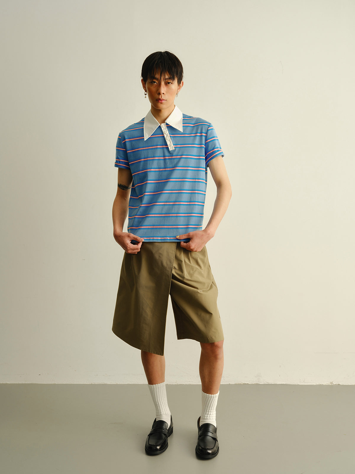 Striped askew collar polo shirt