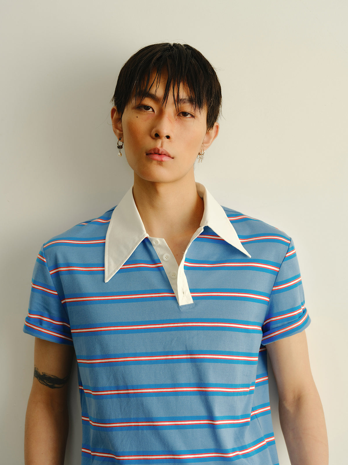 Striped askew collar polo shirt