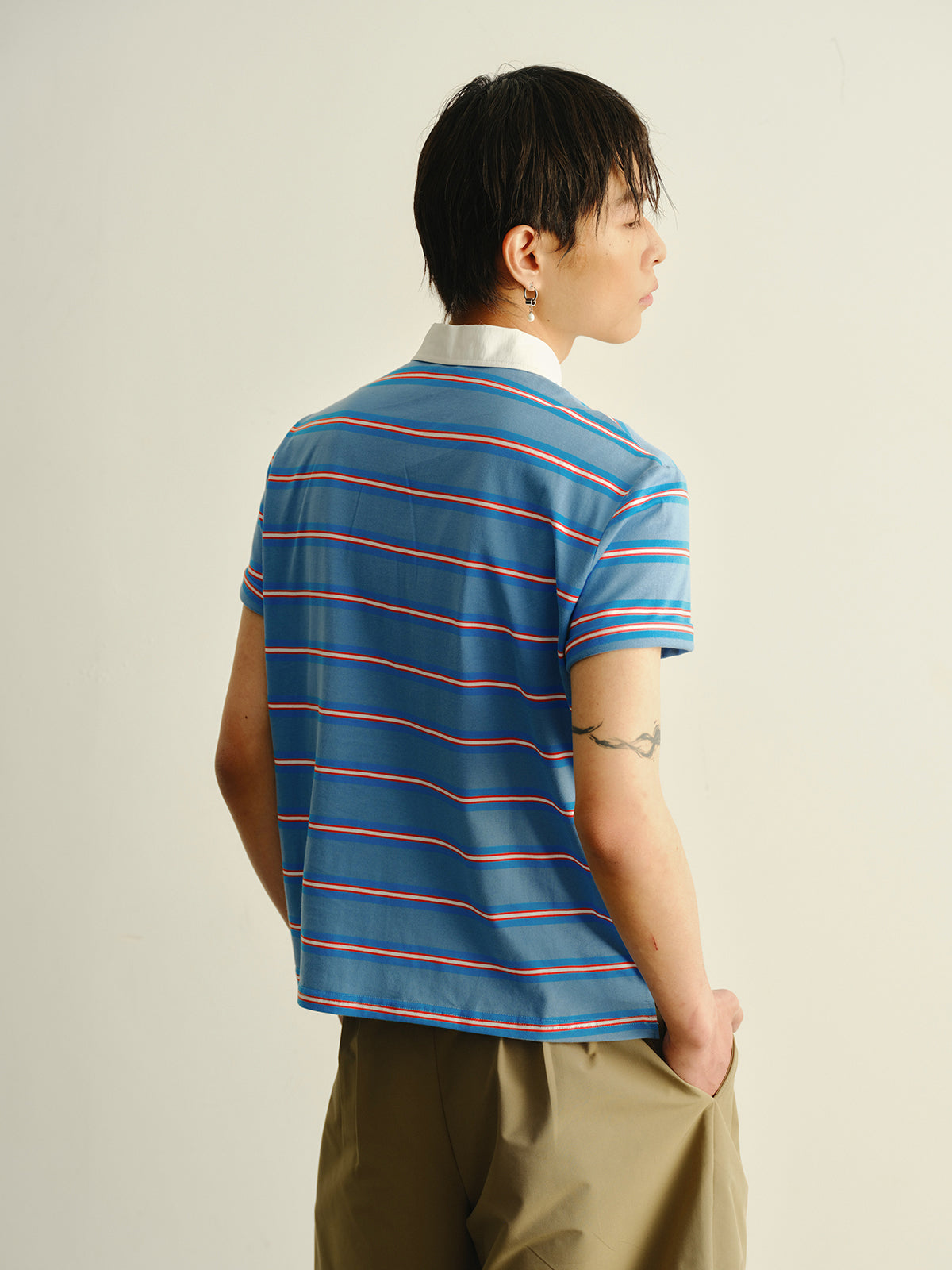 Striped askew collar polo shirt