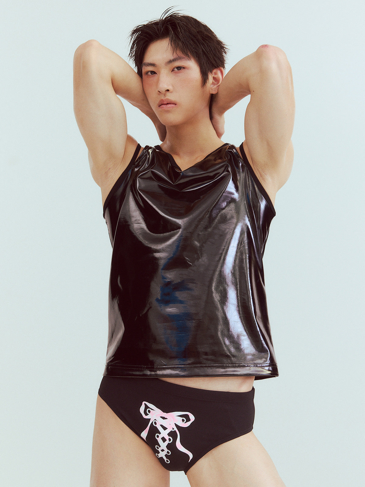 Black swim trunks with bow tie straps
