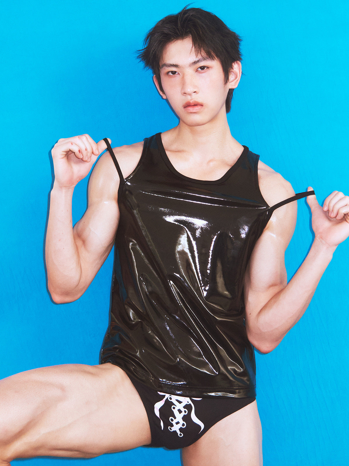 Black swim trunks with bow tie straps